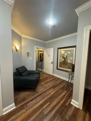 a living room with a couch and a table at Pillow and Paddock B&B in La Grange