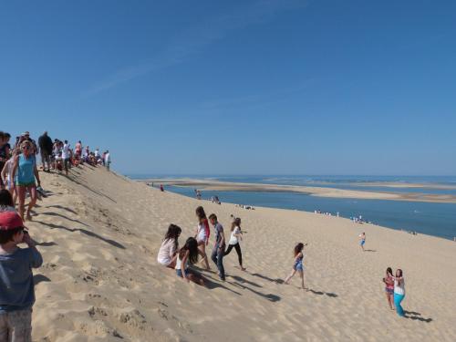 a group of people walking on a beach at Peaceful Villa in Castle Park in Salles