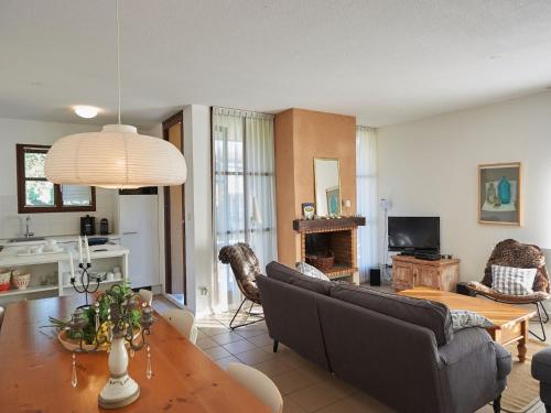 a living room with a couch and a table at Peaceful Villa in Castle Park in Salles