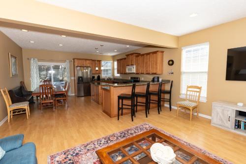 a kitchen and living room with a table and chairs at 5 Bedroom Home in Old Homestead II in Huron