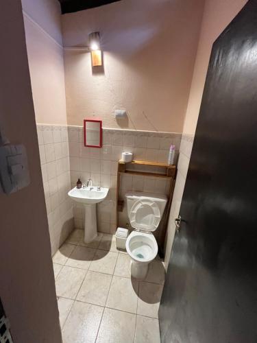 a bathroom with a toilet and a sink at Faustina in Purmamarca