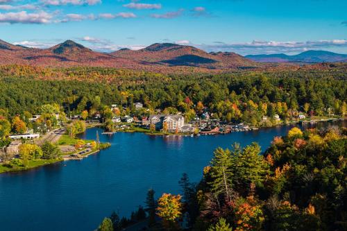 an aerial view of a small town on a lake at voco Saranac Lake NY - Waterfront by IHG in Saranac Lake