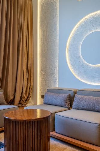 a living room with a couch and a table at Balidian II LOFT 3 1BR in Pesanggaran