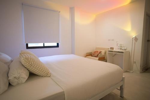 Ένα ή περισσότερα κρεβάτια σε δωμάτιο στο Place Hotel