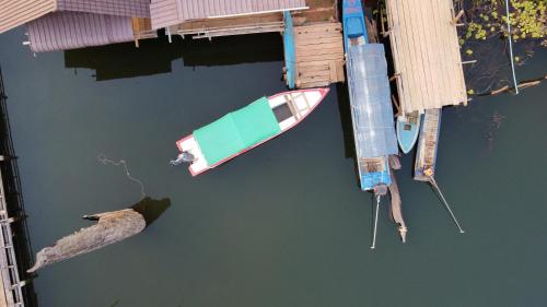 an aerial view of a boat and a dock at Cardamom Community Center in Moăt Preăh