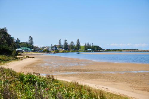 a view of a beach with water and trees at The Shack at Harrington in Harrington