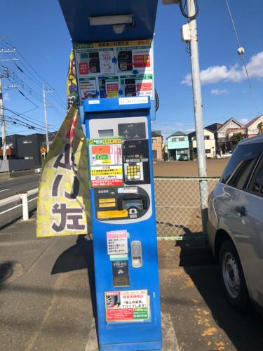 a blue gas pump on the side of a street at Nara House R1 in Kawagoe