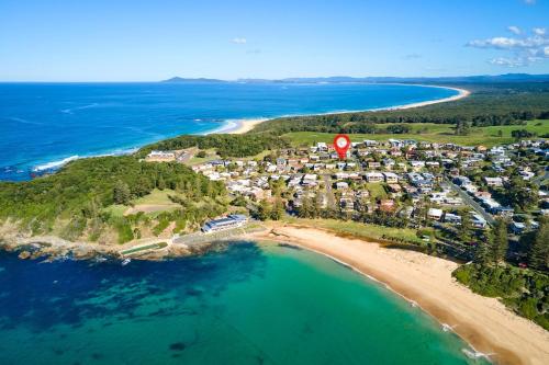 an aerial view of a resort on a beach at The Boat House in Hallidays Point