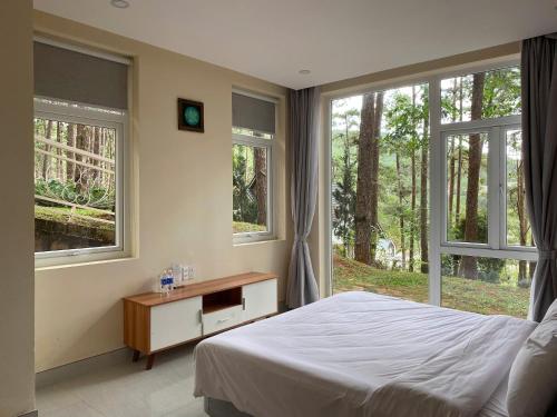 Ένα ή περισσότερα κρεβάτια σε δωμάτιο στο Lan Anh Villas Resort
