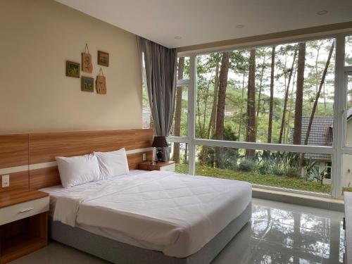 Ένα ή περισσότερα κρεβάτια σε δωμάτιο στο Lan Anh Villas Resort