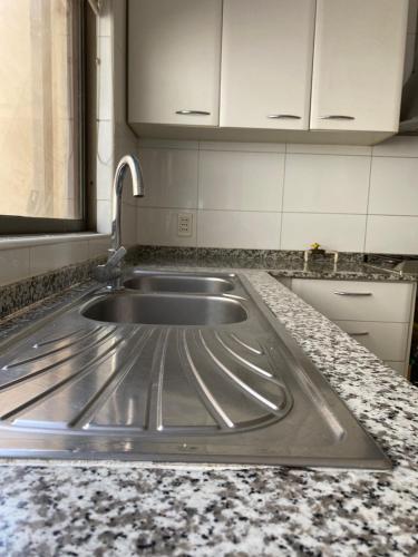 a kitchen with a sink and a counter top at Casa Amplia y Comoda SyS Suites in Chicureo Abajo
