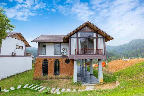 a house on the side of a hill at Thang Mây Village - Ba Vì in Ba Vì