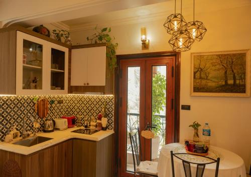 a kitchen with a sink and a counter top at Amazing View, Natural View, 3' To Hoan Kiem Lake, Free Wifi, Netflix, 2 Beds, 1 Toilet-2 Showers in Hanoi