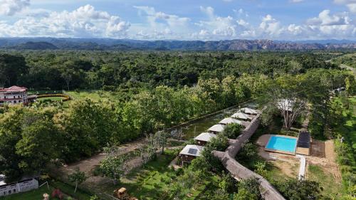 an aerial view of a resort with a pool and trees at Tropical Magnolia in Hellgate