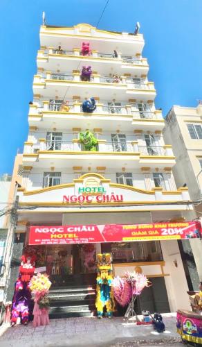 a large white building with a sign on it at Ngọc Châu Hotel in Vung Tau