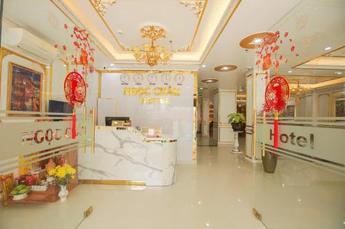 a lobby of a store with red decorations on the wall at Ngọc Châu Hotel in Vung Tau