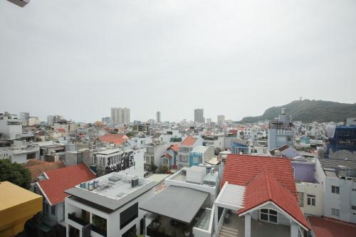 a view of a city with houses and buildings at Ngọc Châu Hotel in Vung Tau