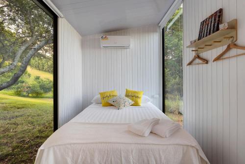 Voodi või voodid majutusasutuse Tiny House Elevation 152 by Tiny Away toas