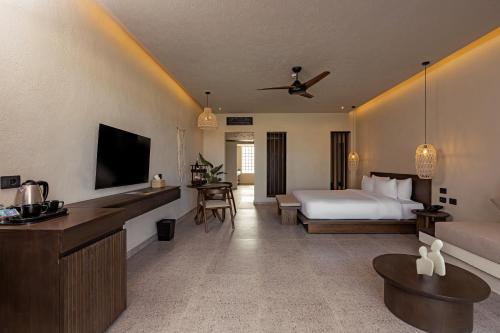 a hotel room with a bed and a couch at Sentido Naga Bay - Adults friendly in Hurghada