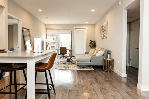 a kitchen and living room with a table and chairs at Magnificent two bedroom in West Hollywood in Los Angeles