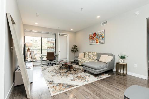 a living room with a couch and a chair at Magnificent two bedroom in West Hollywood in Los Angeles