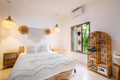 Postel nebo postele na pokoji v ubytování SIN Ubud