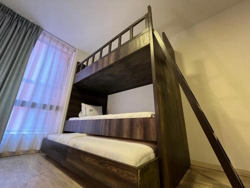 a bedroom with a bunk bed with a ladder at Hotel Lepanto Reforma in Mexico City