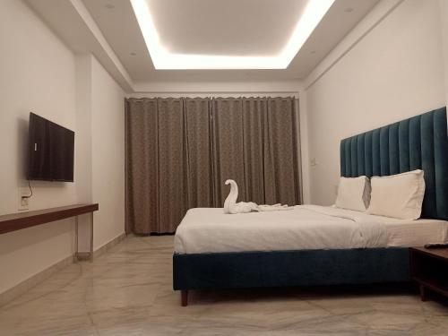 TV a/nebo společenská místnost v ubytování Ritz The Boutique Hotel