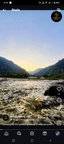 a computer screen showing a picture of a river at Amrah Resort in Bairāgarh