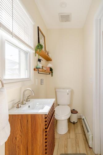 a bathroom with a toilet and a sink at Jersey Haven NYC Next Door - Single car FREE PARKING in Fairview
