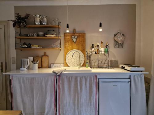a kitchen with a sink and a counter top at Kleine Auszeit in Detmold