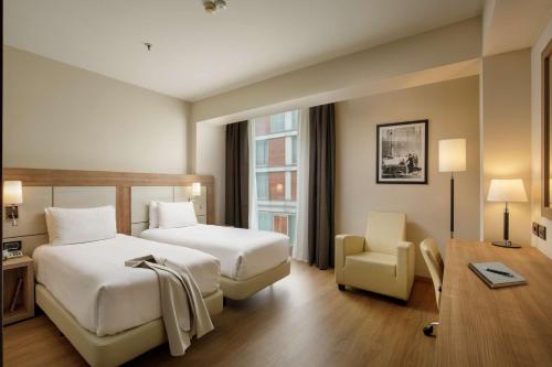Postel nebo postele na pokoji v ubytování DoubleTree By Hilton Milan
