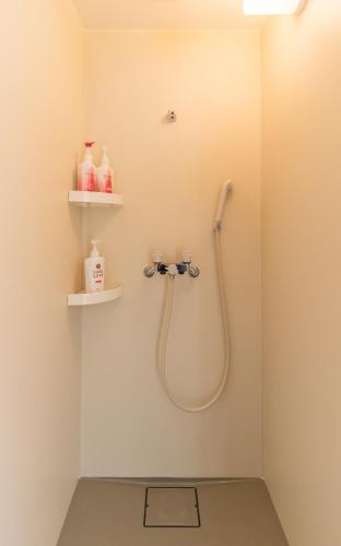 a bathroom with a shower and a sink at Flower Base Lily House - Vacation STAY 57830v in Fukuoka