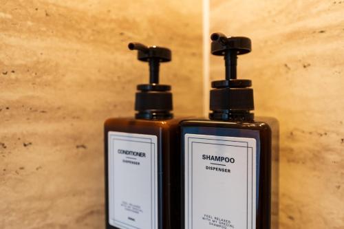 two bottles of soap sitting next to each other at Flower Base Lily House - Vacation STAY 57830v in Fukuoka
