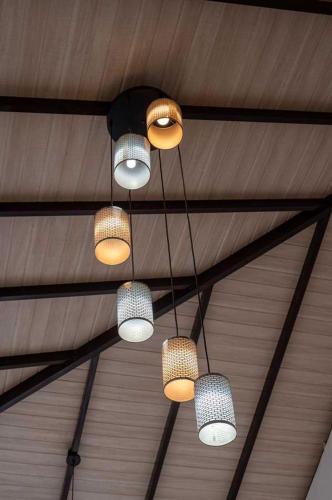 a group of lights hanging from a ceiling at Liora Homestay in Gelioya