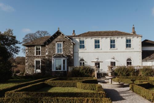 a house with a garden in front of it at Cartmel Old Grammar in Cartmel