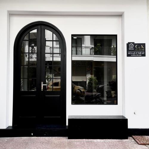 a store front with a black door and windows at C&K Premier Apartment Hai Phong in Hai Phong