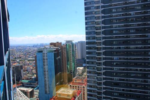 an aerial view of a city with tall buildings at Air Residences-Stylish&Comfort Stay High flat with balcony in Manila