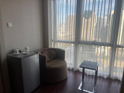 Posezení v ubytování Qingdao Housing International Hotel