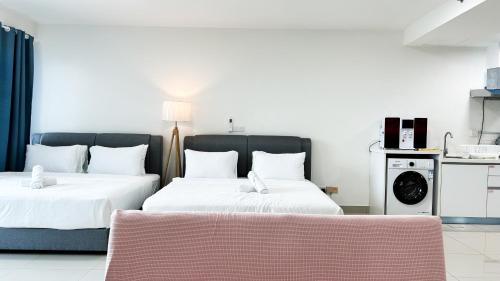 Ένα ή περισσότερα κρεβάτια σε δωμάτιο στο Trefoil by Manhattan Group