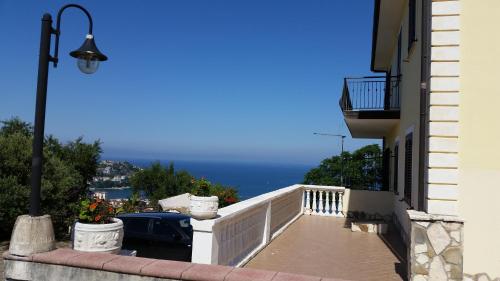 a balcony of a building with a view of the ocean at Villa Malandrino Guest House in Agropoli