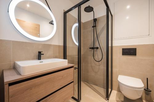 a bathroom with a sink and a shower at Gipfelglueck Family in Kirchberg in Tirol