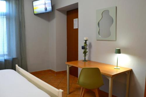 Letto o letti in una camera di DOMUS Hotel