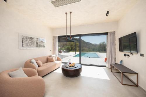 a living room with a couch and a table at Villa Lilia in Katelios