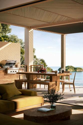 a living room with a couch and a table at Nekajui, a Ritz-Carlton Reserve in Papagayo, Guanacaste
