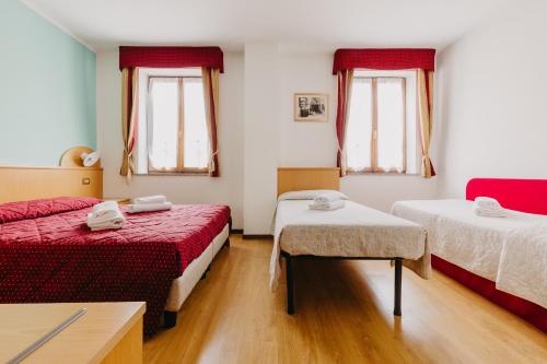 Posteľ alebo postele v izbe v ubytovaní Hotel Spera