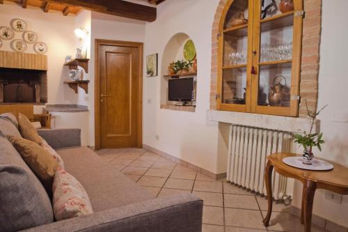 a living room with a couch and a table at SerenaHouse in Radicondoli