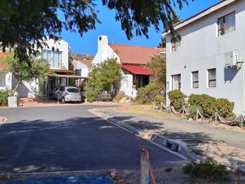a street in a small town with a building at Saint Anna Beach House in St Helena Bay