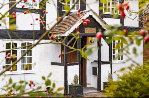 a house with a gingerbread house on the door at Bramble Cottage in Atcham