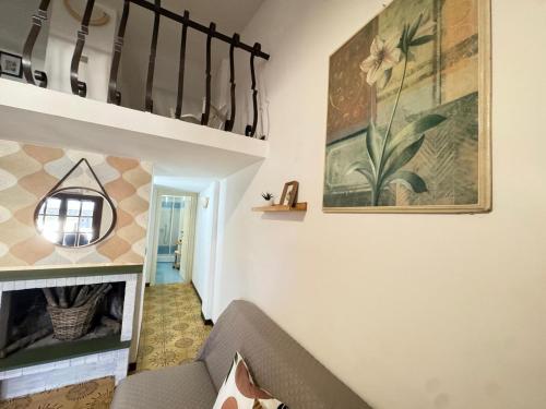 a living room with a couch and a fireplace at Casa di Giggia in Marina di Cerveteri
